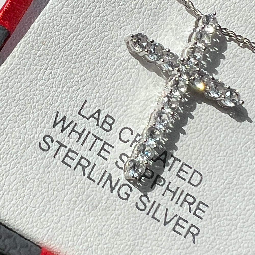 Silver cross pendant with  white sapphires